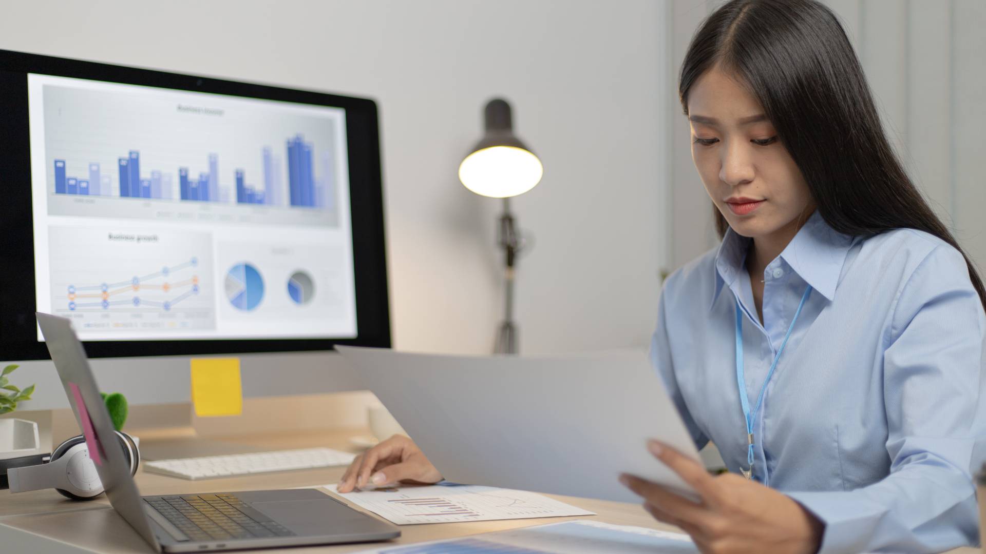 A woman sitting at a desk working.
