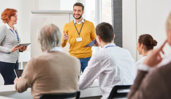 a diverse group of people are participating in professional development program
