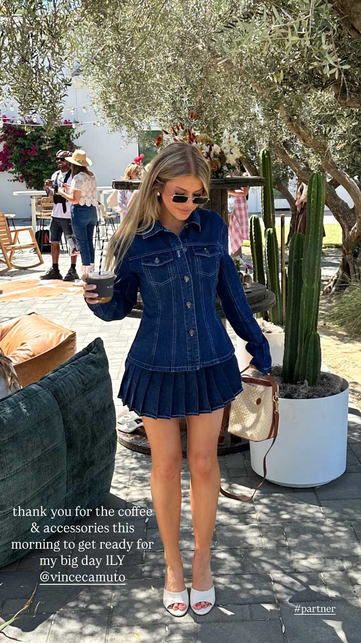 Woman in denim jacket and pleated skirt holding coffee at outdoor event. Brought to you by Plural, NYC: Experts in Social Media Marketing Strategy and High-Quality Content Production.