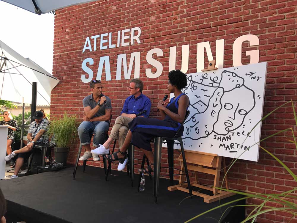 A panel discussion at an outdoor Samsung event with three speakers seated on stage.  Image courtesy of Plural, NYC - Social Media Marketing and Content Production Studio.