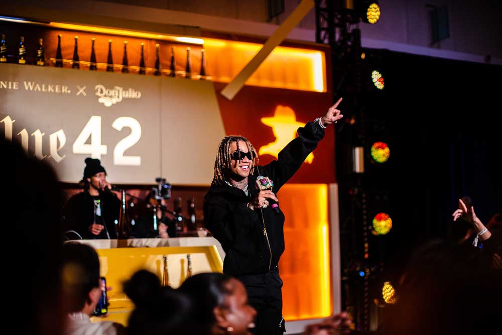 Performer on stage at a "Blue 42" event by Johnnie Walker and Don Julio. Image courtesy of Plural, NYC - Social Media Marketing and Content Production Studio.