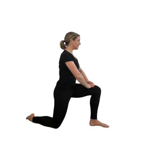 woman in black doing a hip flexor stretch.