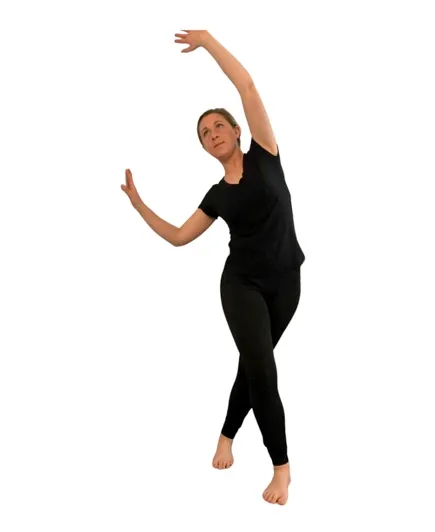 woman in black doing a iliotibial band stretch.