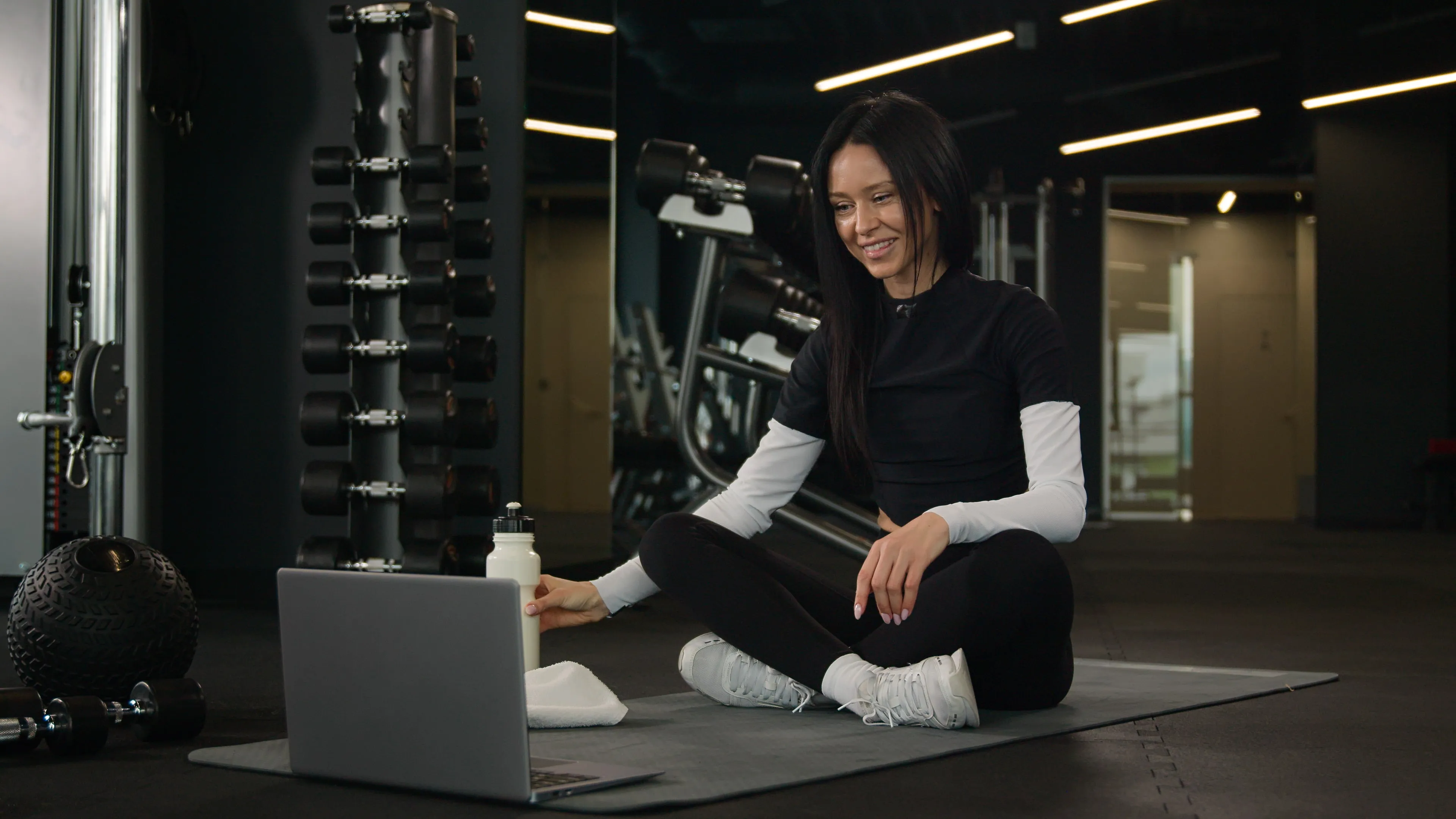 female at gym on computer