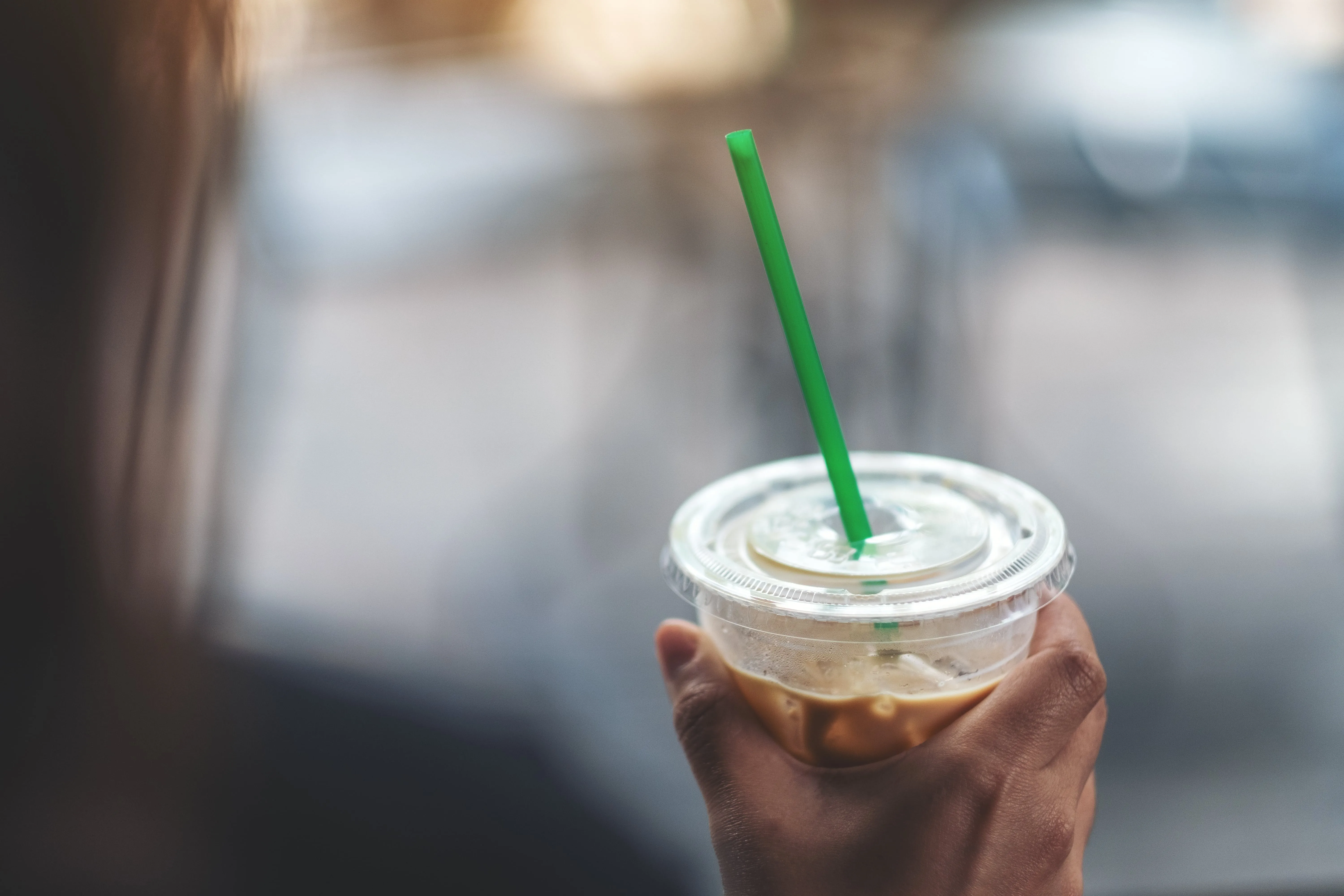 woman holding coffee cup