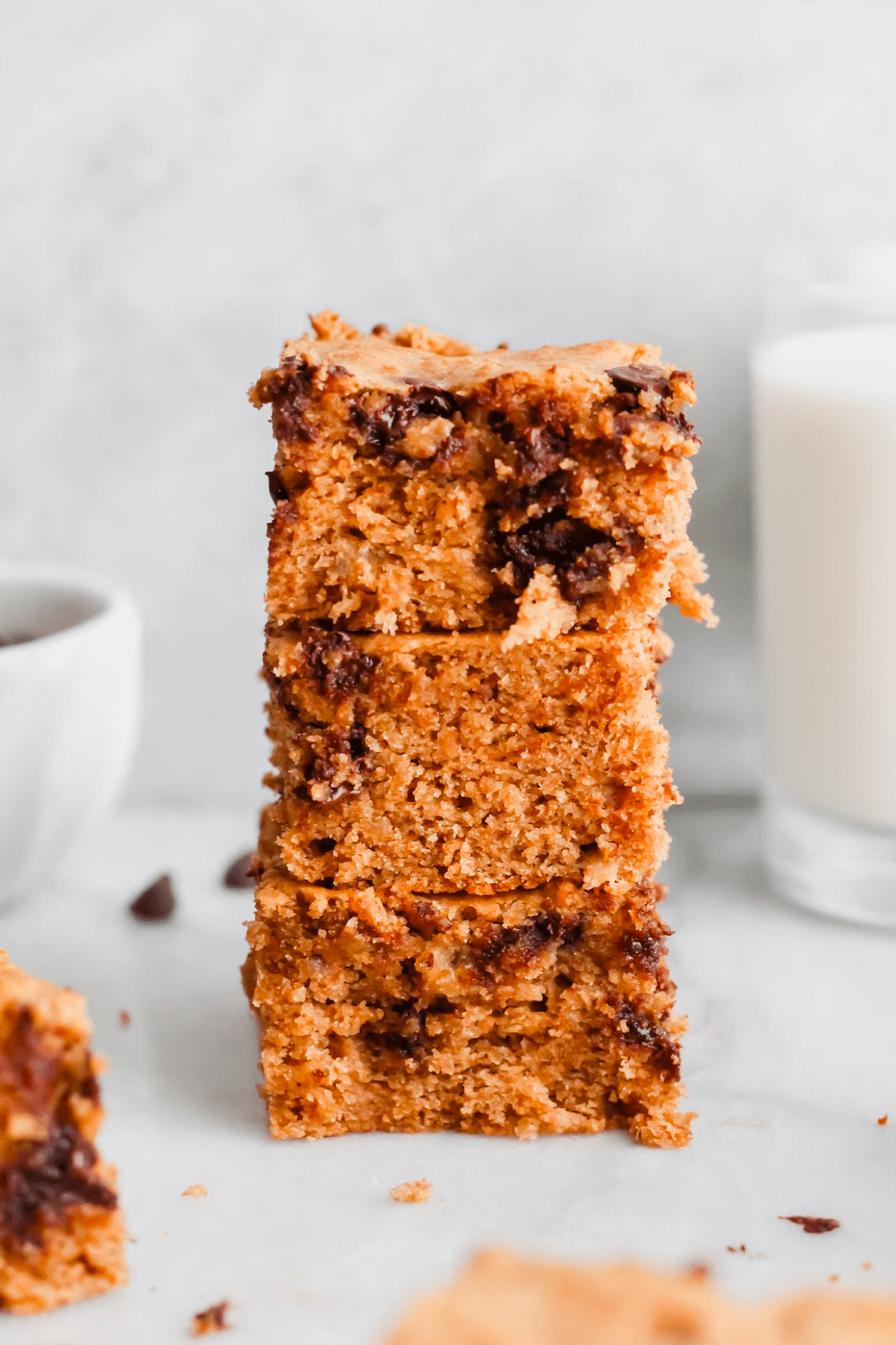 Stacked chocolate chip blondies with golden brown texture
