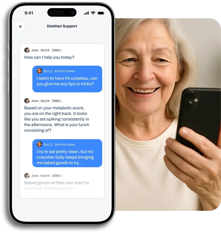 Smiling elderly woman looking at phone with dietitian chat screen