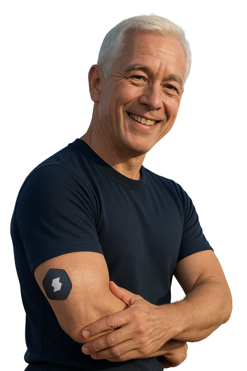 Smiling older man in navy shirt with crossed arms and tattoo