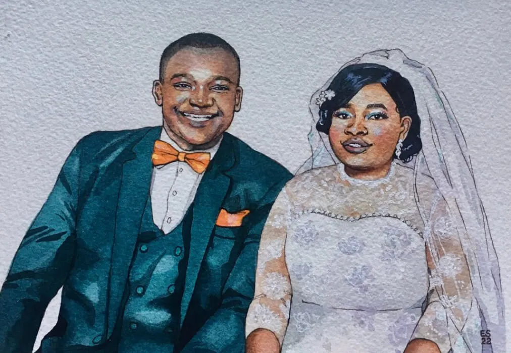 An ink and watercolour portrait of a smiling black African couple sitting together after their wedding ceremony. The husband has short hair and is wearing a navy suit, white shirt, orange bow tie and matching handkerchief in his top left pocket. The wife has her hair in a low bun, with a lace veil draping down her back. She wears a white wedding dress with lace sleeves.
