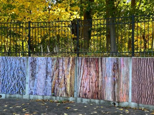 Fence wrapped with art by Laurie Lambrecht