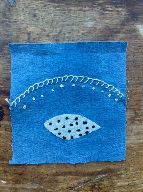 blue fabric with eye shape by Mina Teslaru
