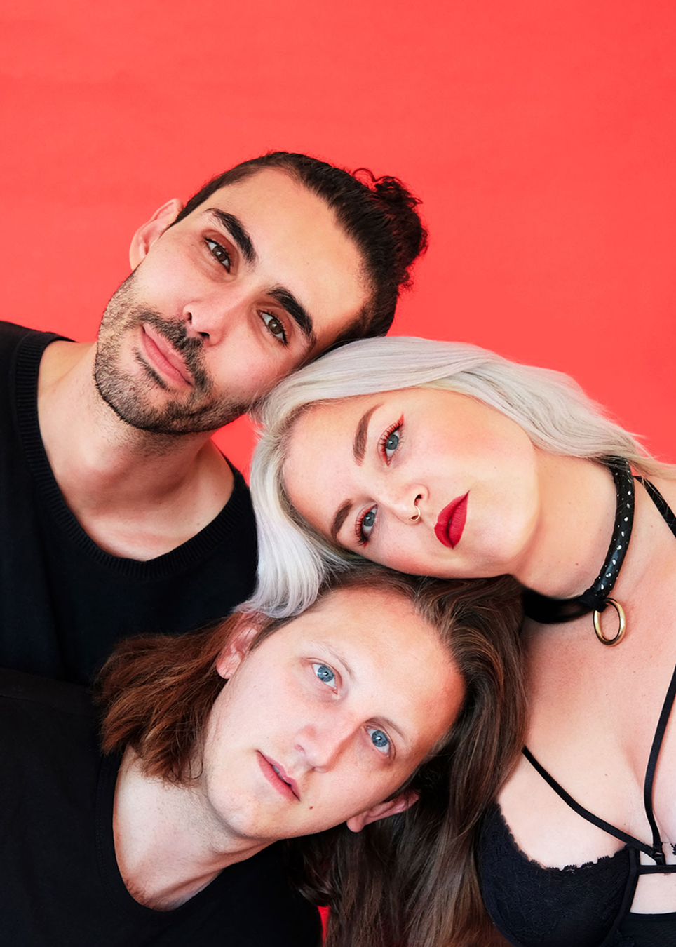 Still life of fruit and found objects against an orange backdrop.