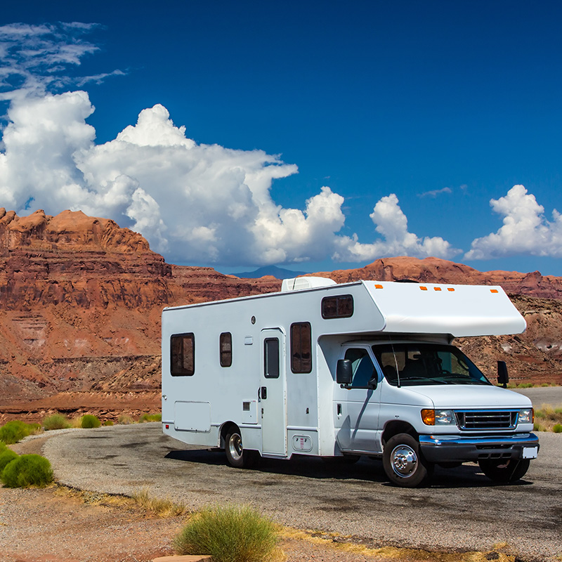 The cover of the software checklist PDF displaying a beachside campground with the title "How to Evaluate Reservation Software. Questions to Keep in Mind."