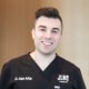 Headshot of Dr. Adam Avitan, a male DVM smiling with short brown hair 