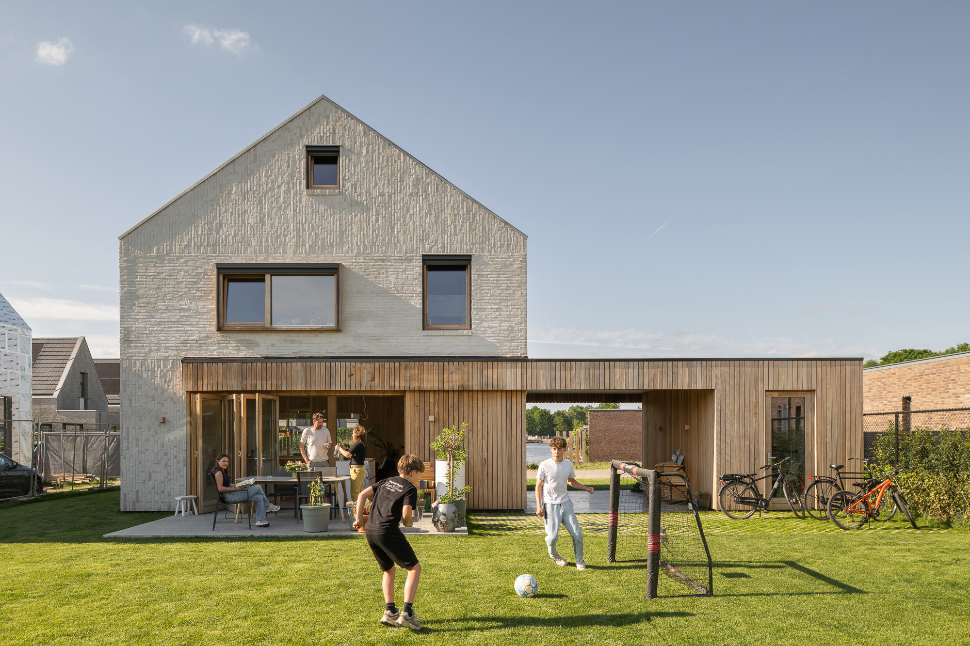 Houten Huis is a cross-laminated timber family home in Waalwijk designed by Studio Space Architecten, combining sustainable construction with an archetypal form at the edge of a new waterfront. Selected for the Archilovers Best Projects list.