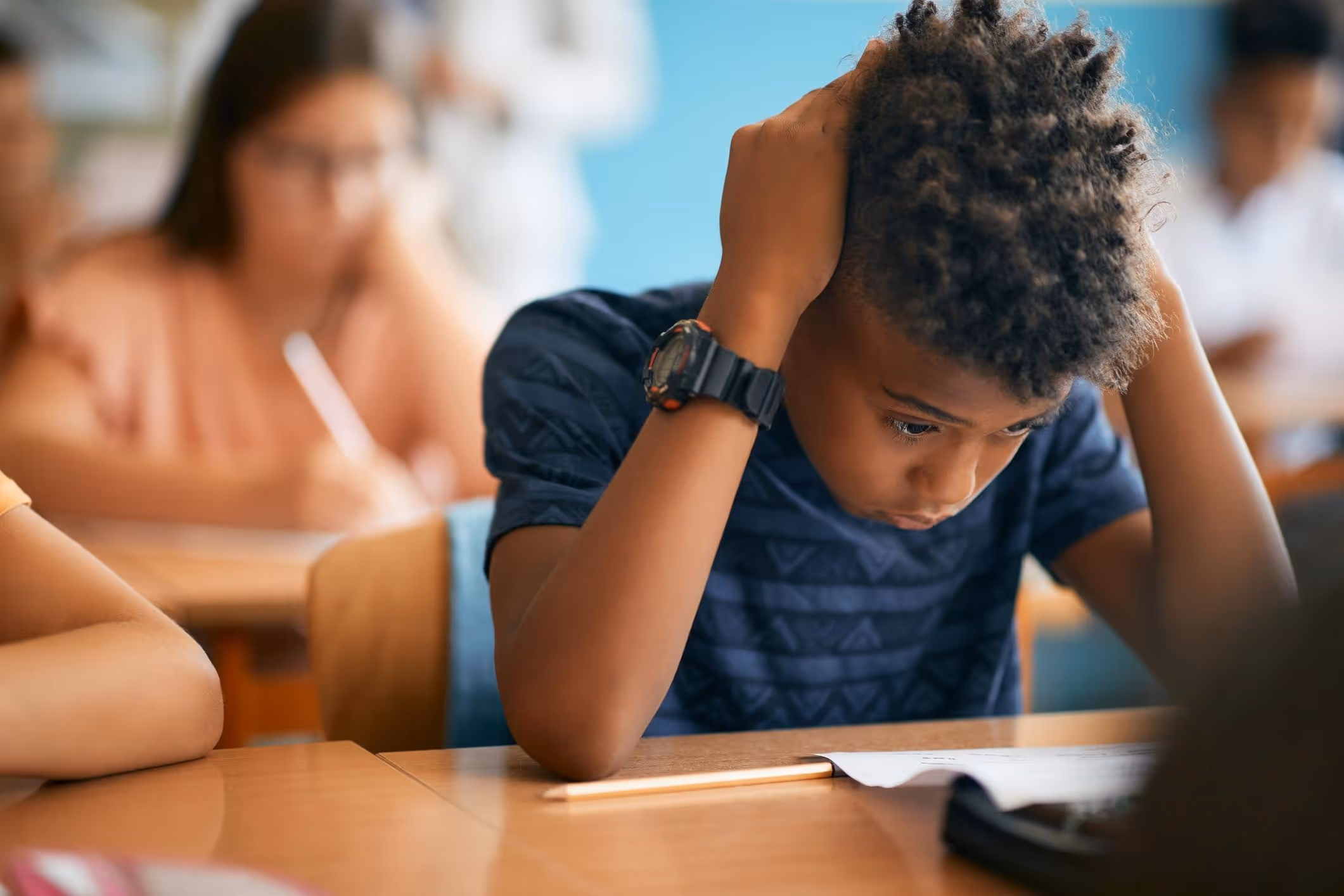 A young boy thinking about the prevalence of sexual assault in California schools