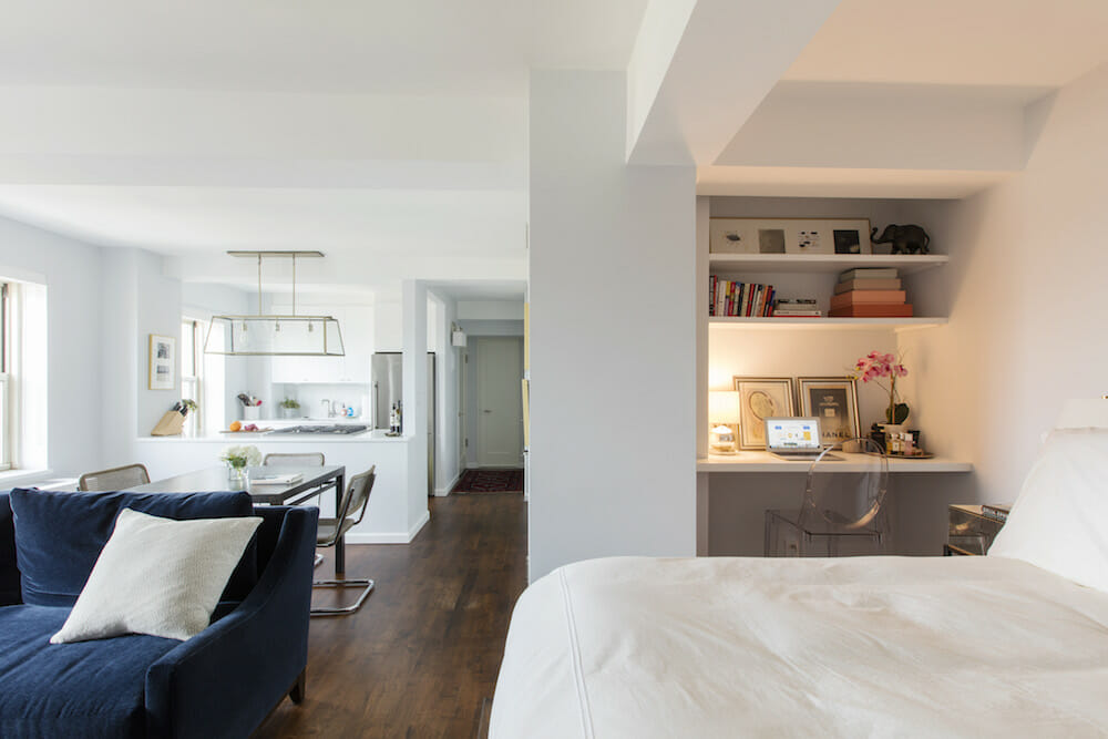 a bedroom with a bed and a couch