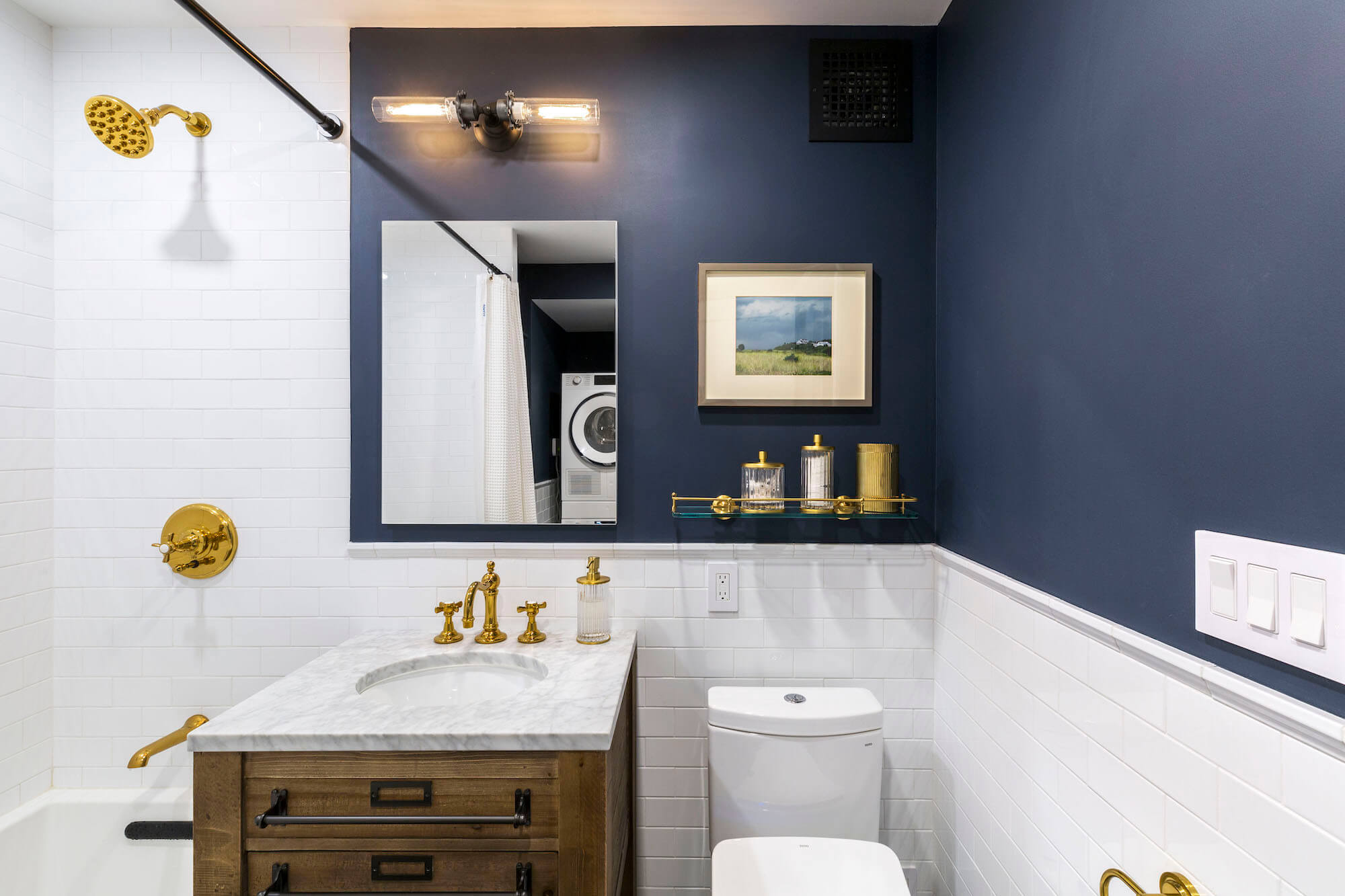 a bathroom with a blue wall