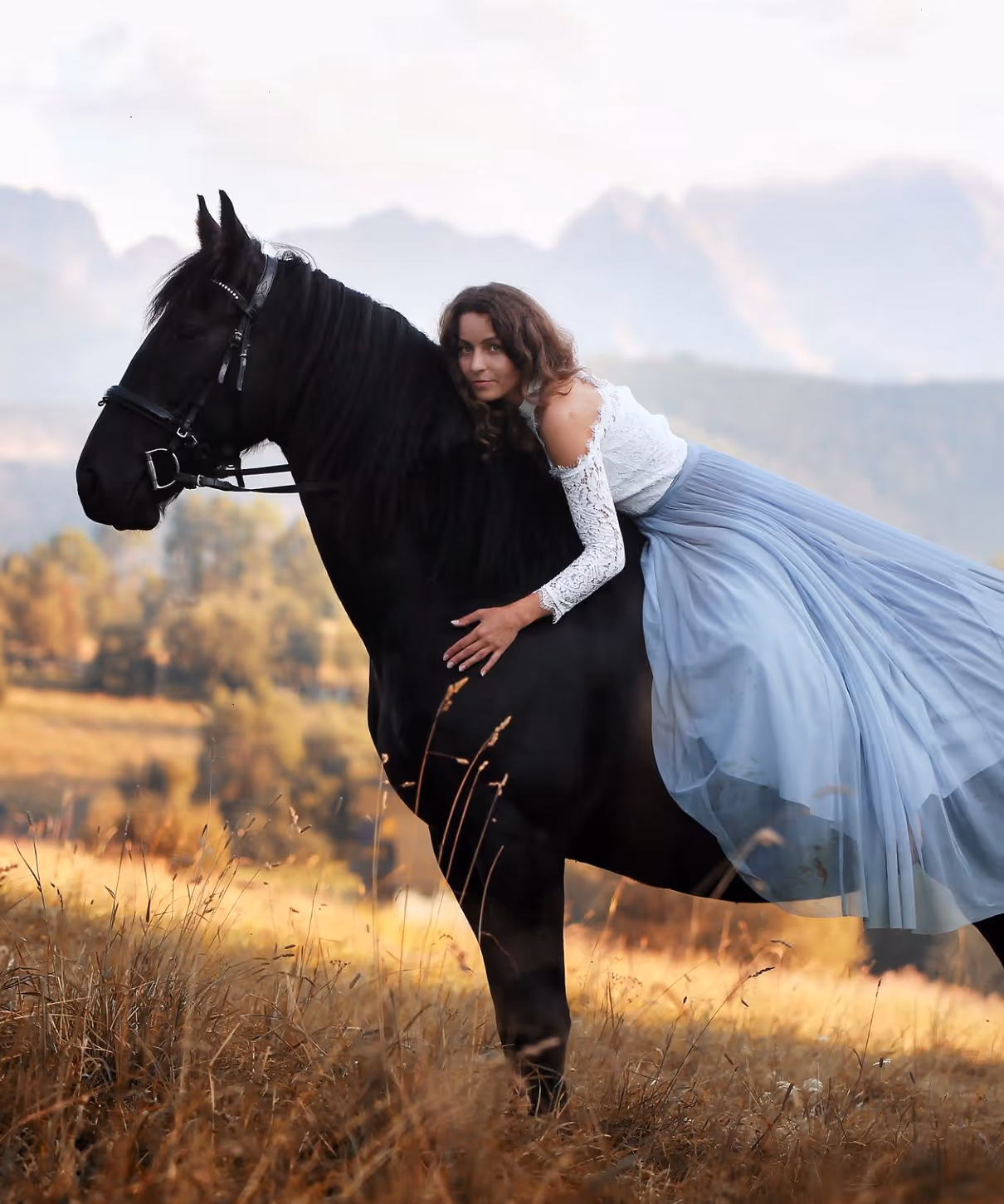 A photo of a woman on a horse.