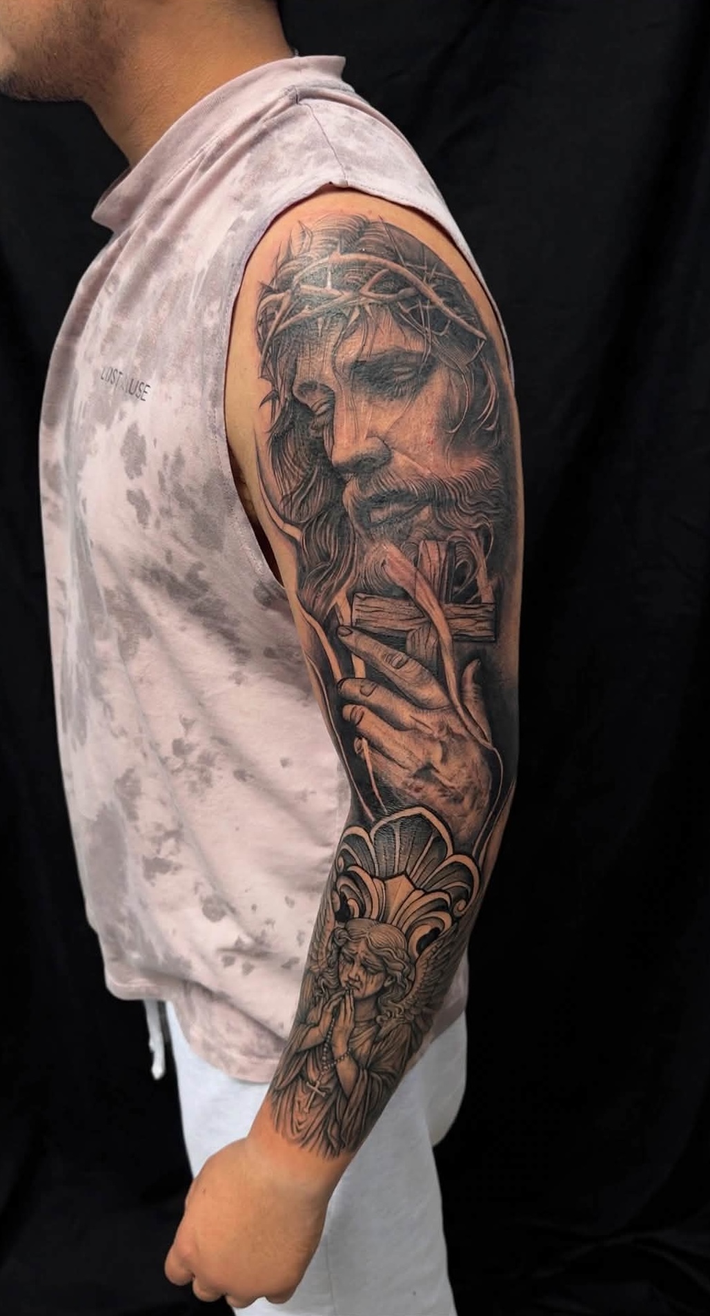 jesus christ black and white full arm tattoo