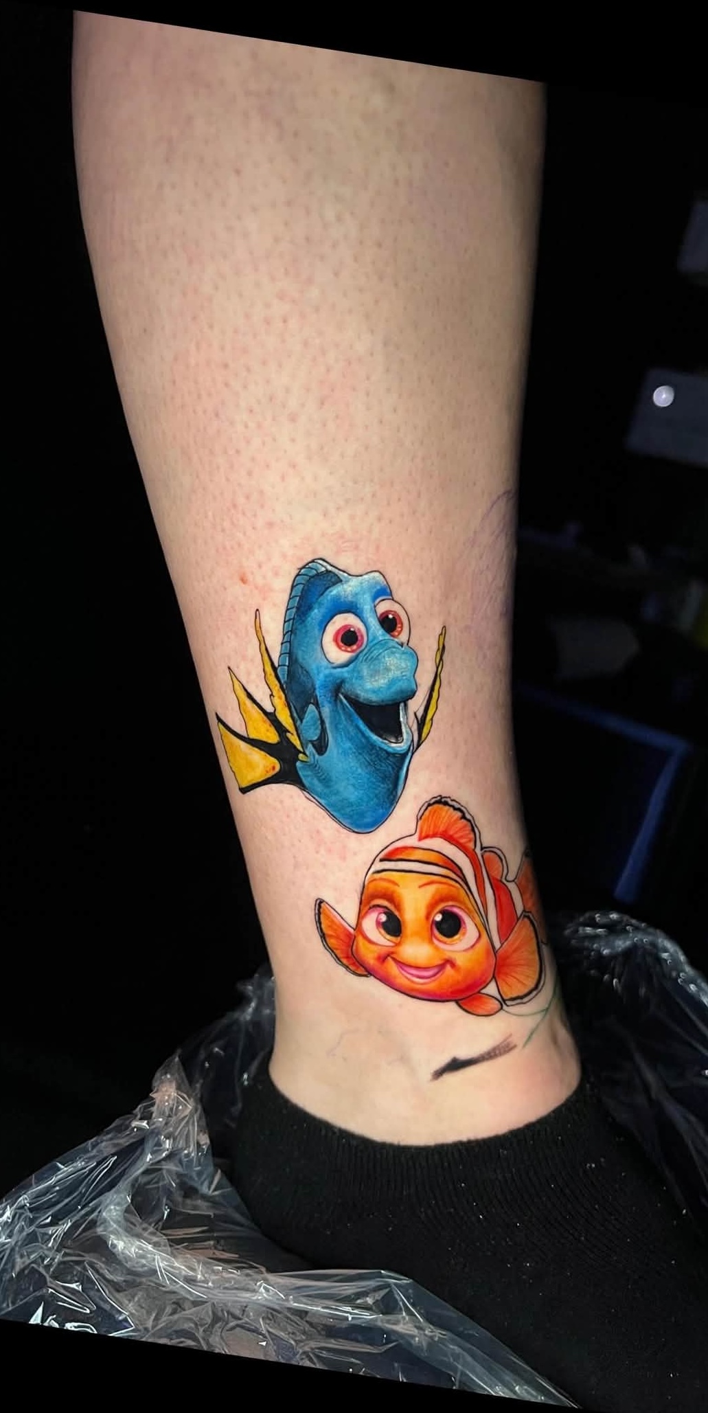 Nemo and Dory fish colored tattoo