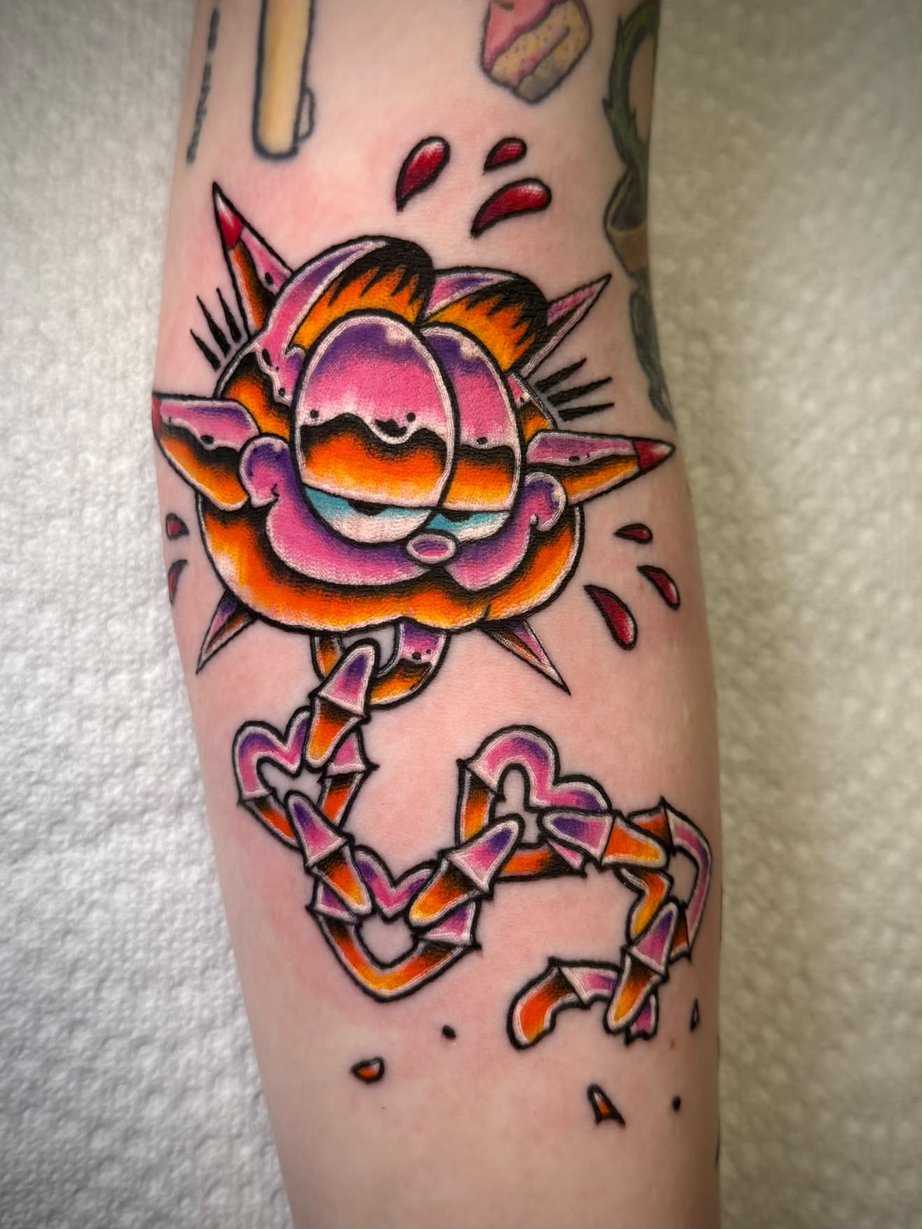 Garfield spiked ball and chain new school tattoo