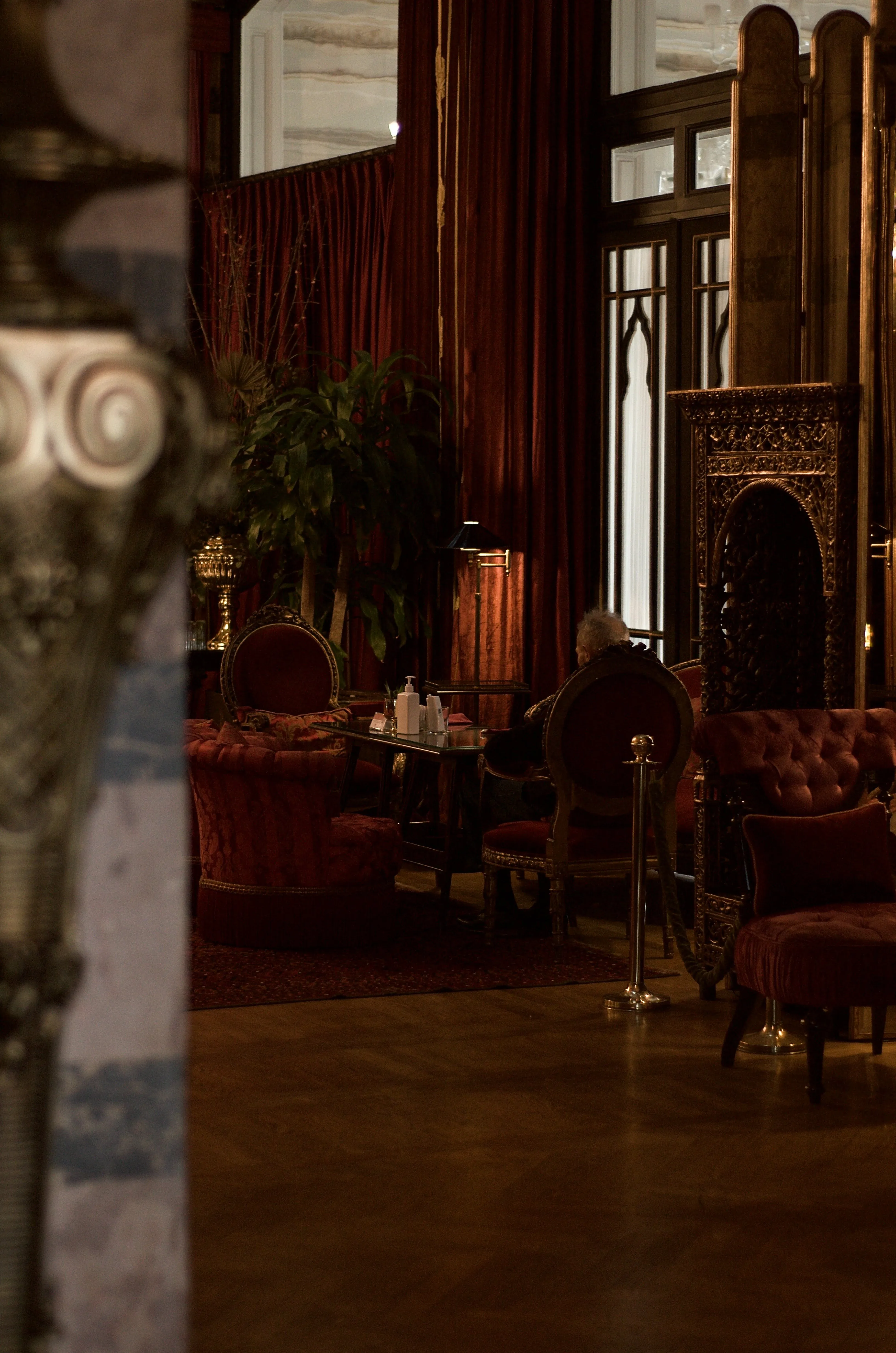 Man sits in a luxury establishment.