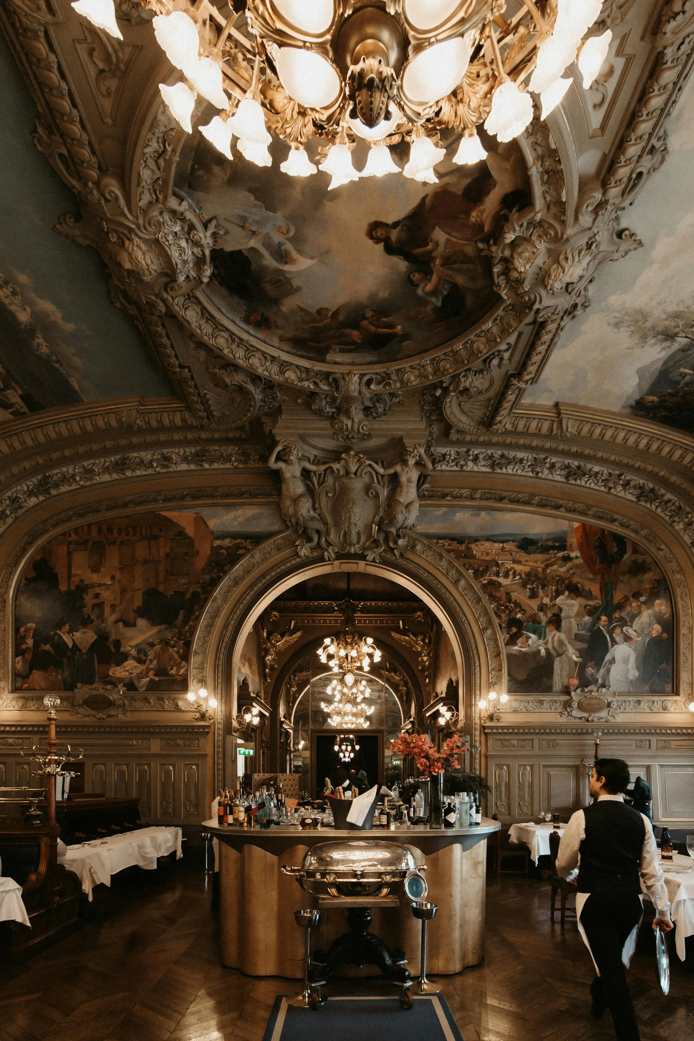 A highly romantically decorated room of a restaurant in Paris.