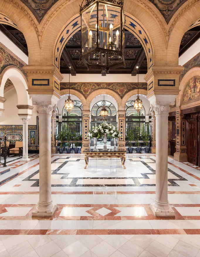 The interior place of Hotel Alfonso XIII feels like an old courtyard in modern day style.