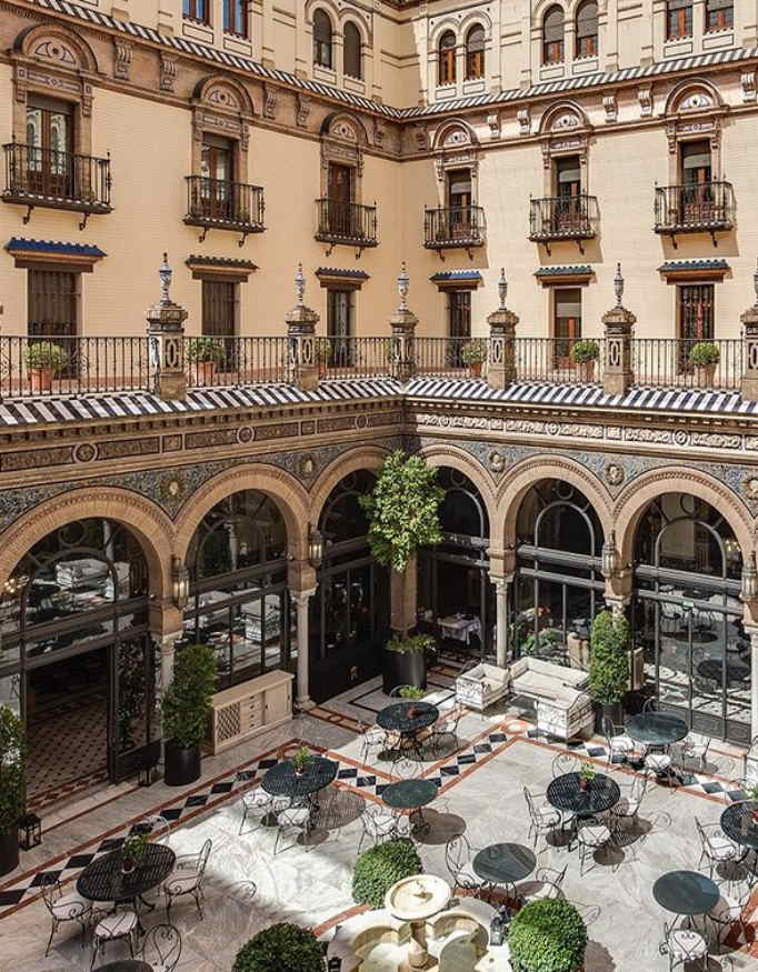 The interior place of Hotel Alfonso XIII feels like an old courtyard in modern day style.