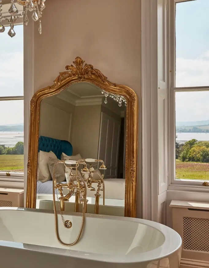 A bath in a suite with a special view of the surroundings of Lympstone Manor.