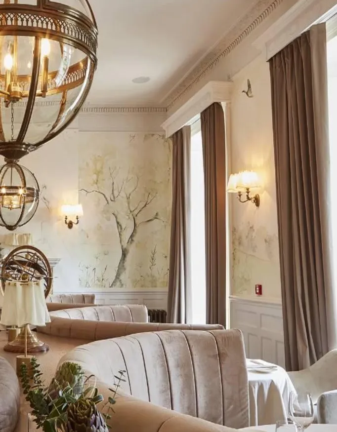 Beautiful modern but with classic elements restaurant in the Lympstone Manor. with a view of the surroundings.