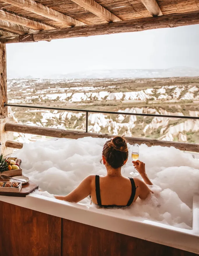 A woman in a jacuzzi in a suite at the Hotel Argos In Cappadocia.