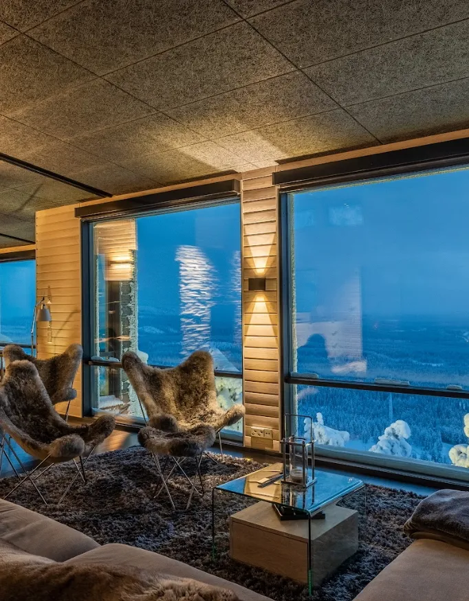 The sun has set and from the living room you have a special view over a nature reserve at Villa Ruka.