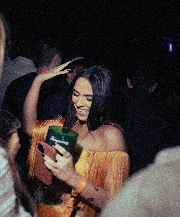 A young lady dancing at a festival in Spain having fun.