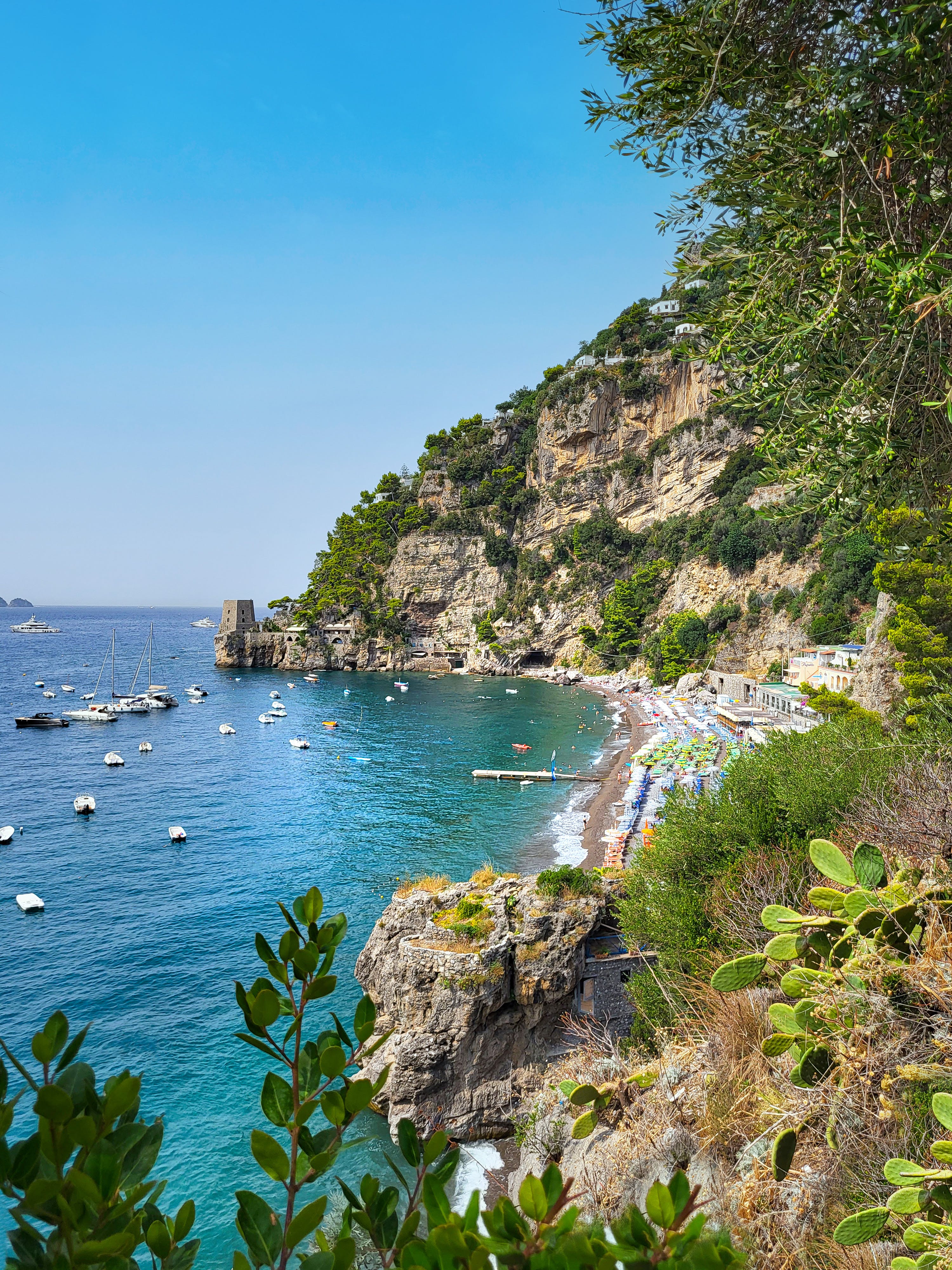 Crystal clear water with cliffs at the Amalfi coast during a beautiful sunny day.