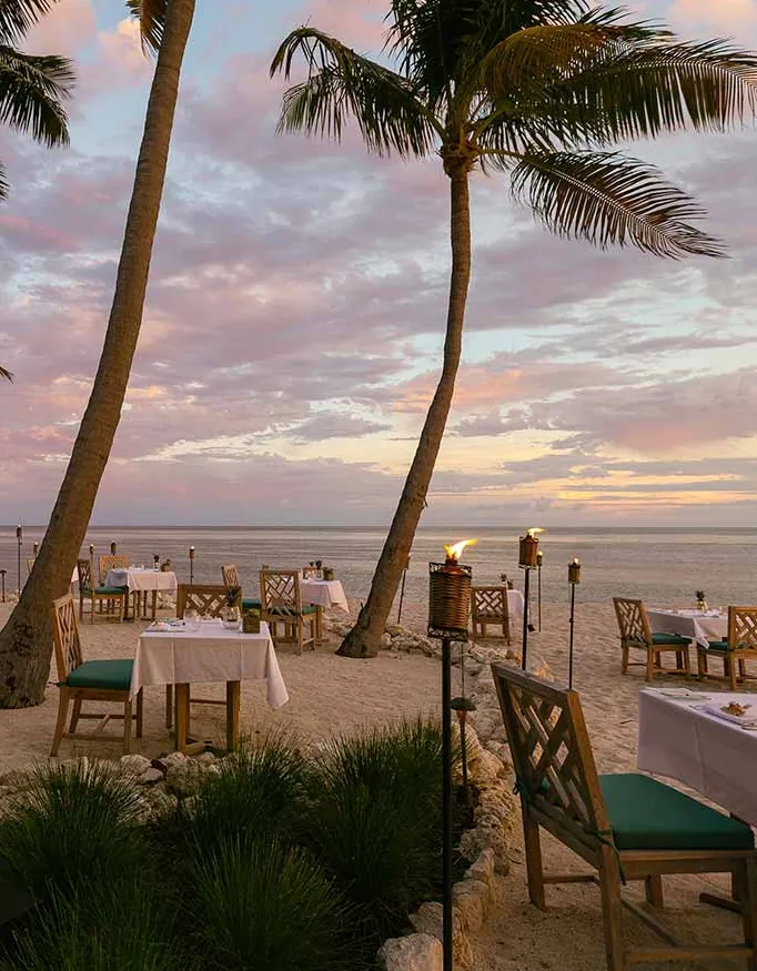 Dinner at the private beach of Little Palm Island Resort & Spa during sunset.