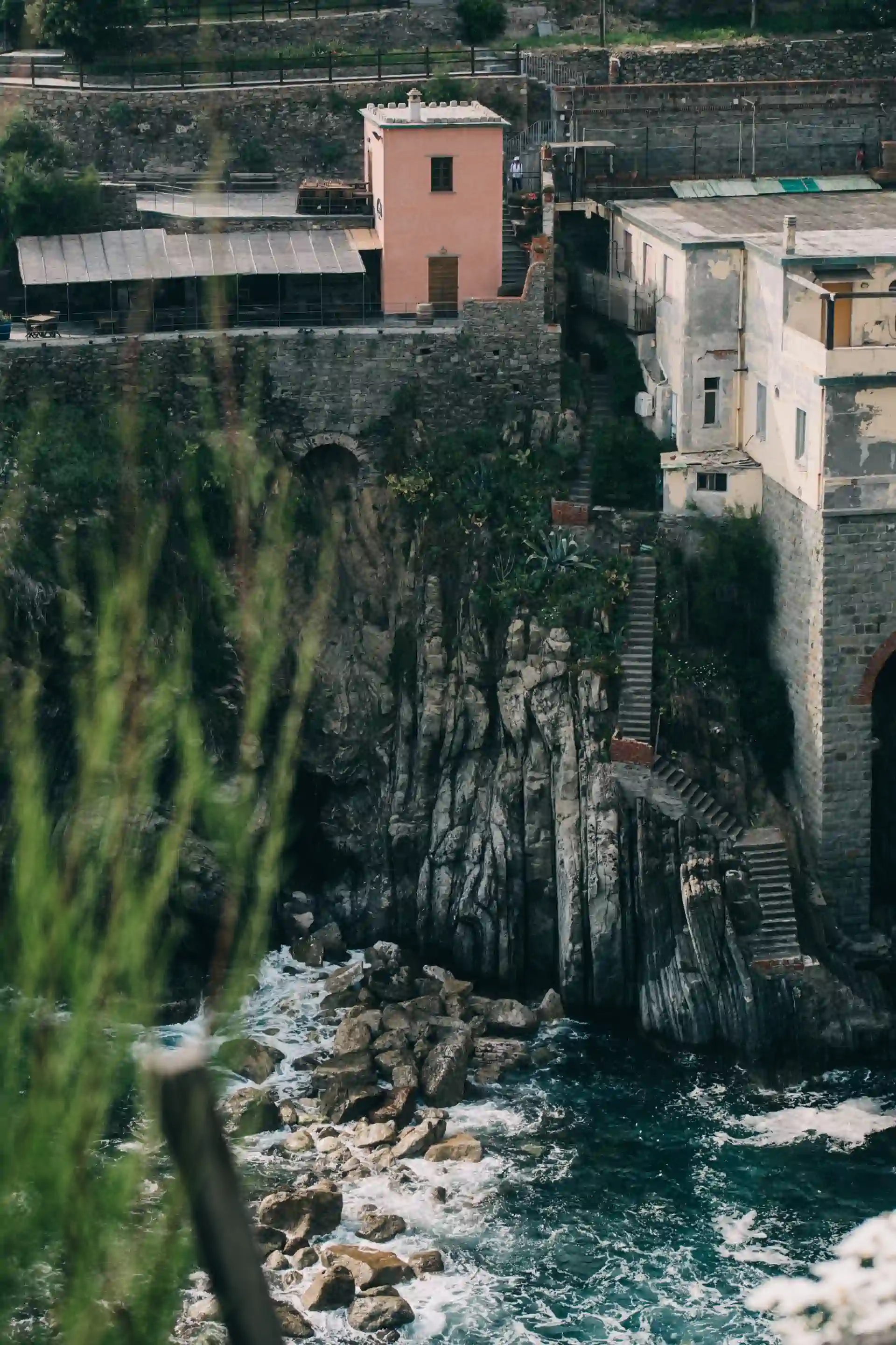 Colourful buildings at the French coastline on a clif near the sea.