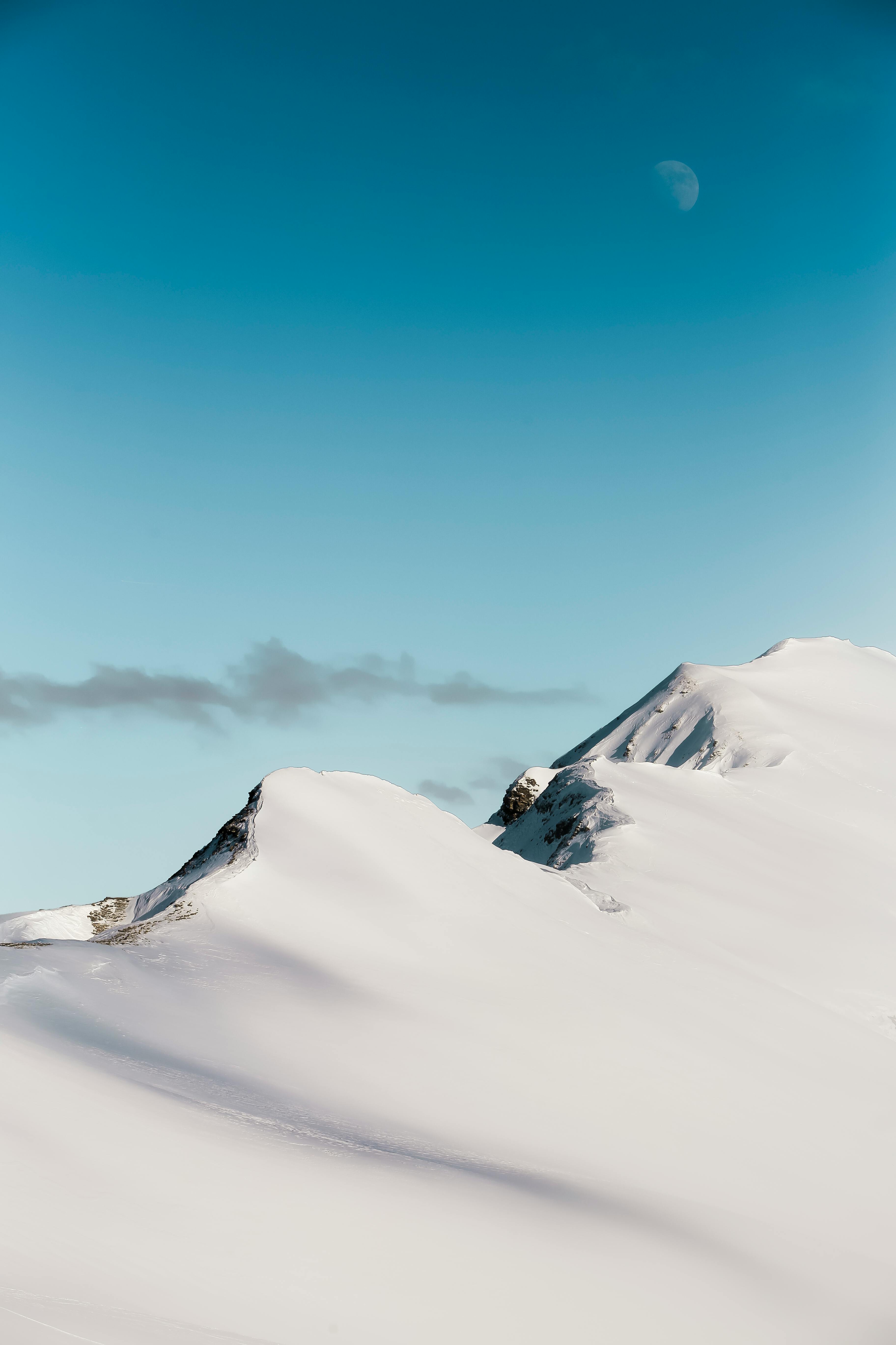 Snowy mountain tops with a clear blue sky