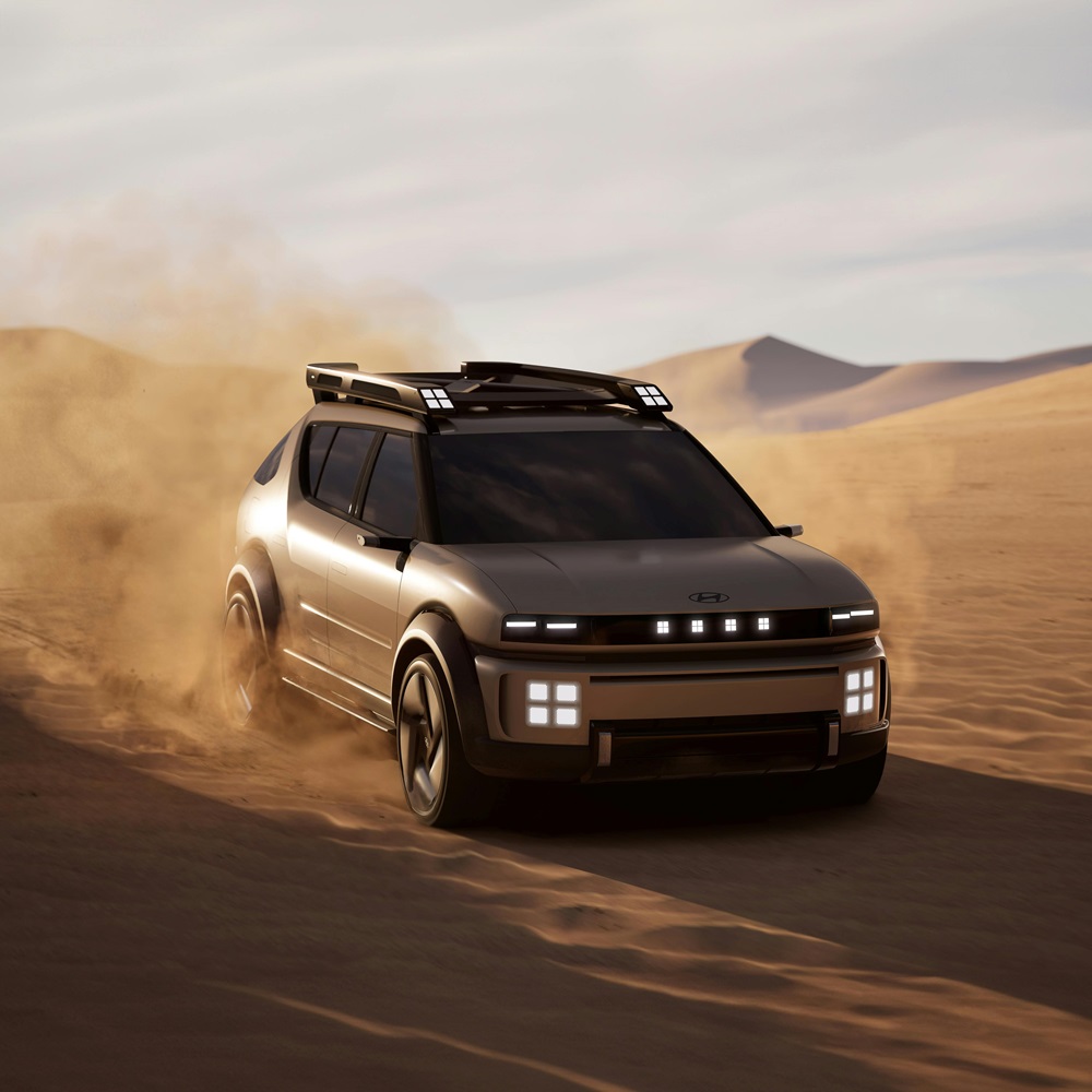 A Hyundai driving throug the desert.