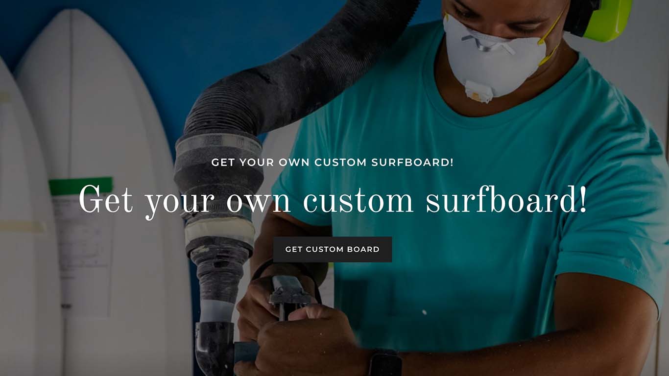 A shaper working on a surfboard