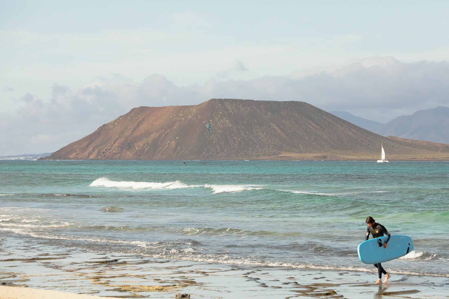 a surfer next to the beach