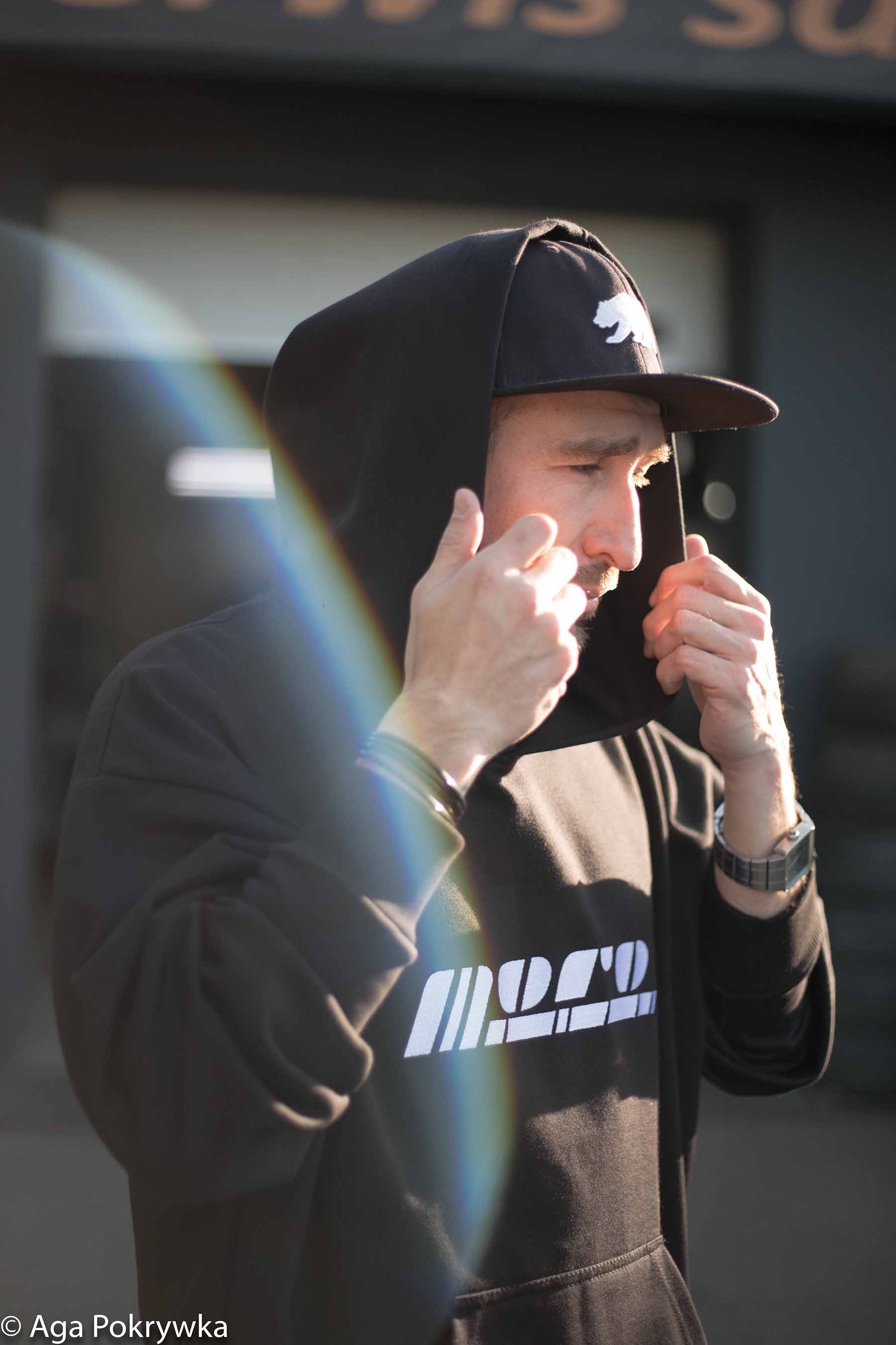 a guy holding his hoody