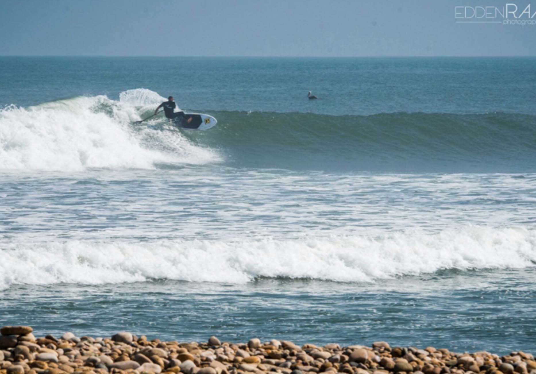 a guy surfing on a wave