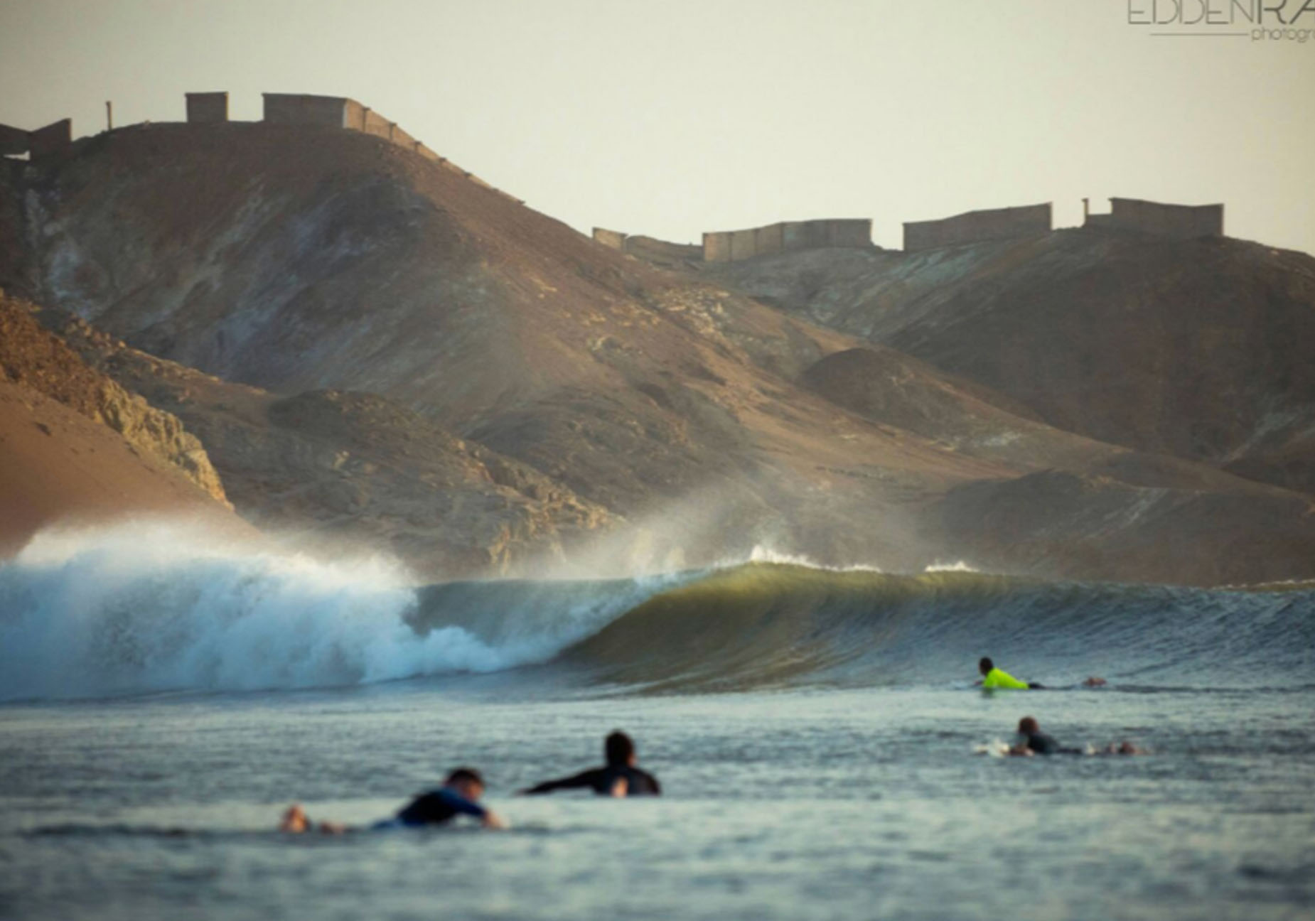 a guy surfing on a wave