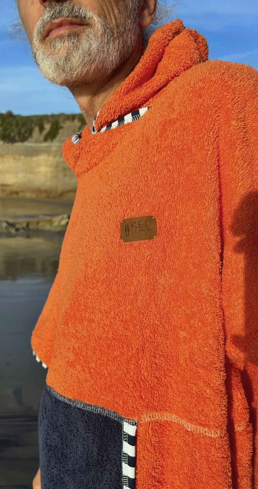 a guy wearing a surf puncho