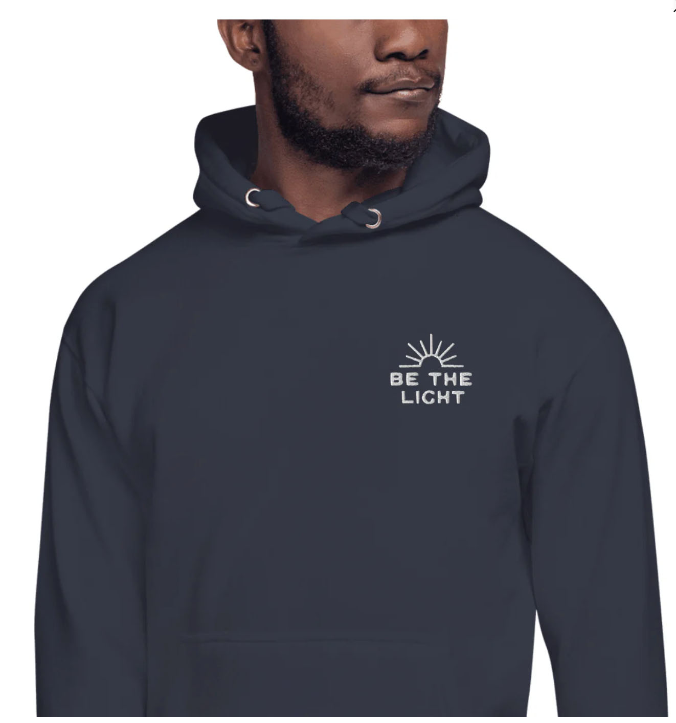 a black man wearing a blue hoodie