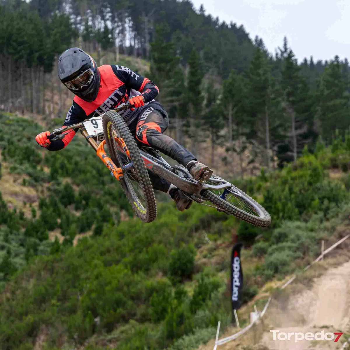 Mountain biker jumping during a Torpedo7 event captured for social media and content production.