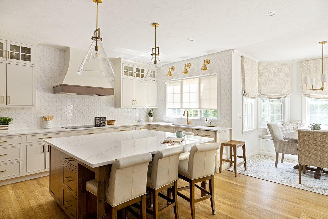 Kitchen with large custom island that promotes a cozy family time with ample space 