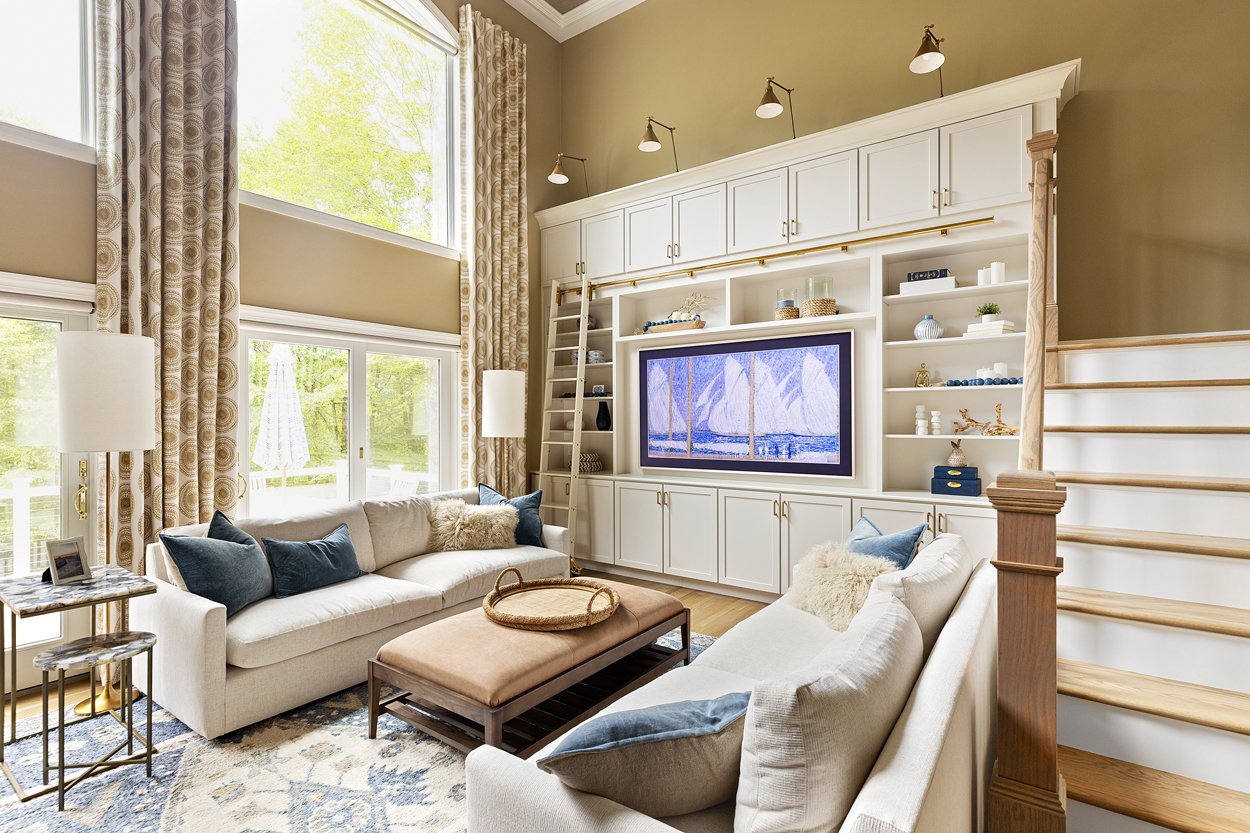 Tall custom built-in for an 85" TV with custom cabinetry